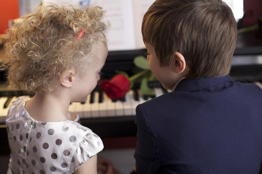 5 TWO CHILDREN AT THE PIANO WITH A ROSE.jpg